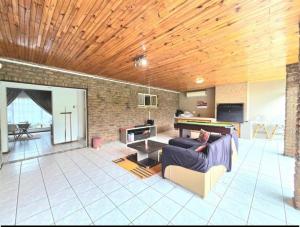 a living room with a couch and a table at Dream vacation home in Vanderbijlpark