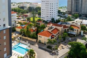 an aerial view of a city with a pool at Caribbean Ocean Breeze Beach Condo! in Juan Dolio