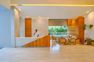 a man standing in the kitchen of a house at Caribbean Sea Waves View, Beachfront Apt. in La Puntica de Juan Dolio +83 photos