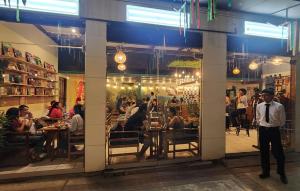a group of people sitting at tables in a restaurant at JATIVI Guest in Pucallpa