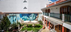 an apartment with a mural on the side of a building at San Sebastian Hotel Boutique in Huaraz