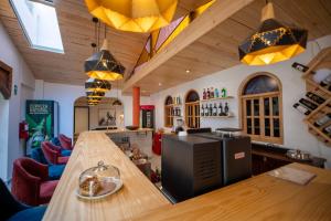 a kitchen with a long counter in a room at San Sebastian Hotel Boutique in Huaraz