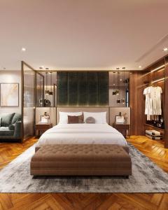 a bedroom with a large bed and a couch at Splendid Secret Hotel in Hanoi