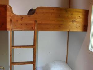 a bunk bed with a ladder in a room at Chalet 5 pers - Terrasse - 2 Chambres - API-1-52-686 in La Mothe-Achard