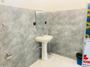 a bathroom with a sink and a mirror at River Nature Park in Polonnaruwa +63 photos