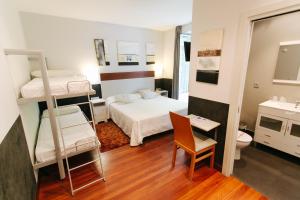 Posteľ alebo postele v izbe v ubytovaní Hostal San Sebastian Centro