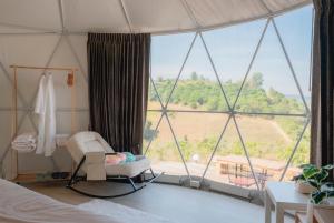 Кровать или кровати в номере Arabica Khaokho