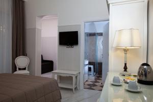 TV a/nebo společenská místnost v ubytování Hotel Residence Villa Del Mare