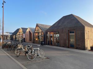 a row of bikes parked in front of a building at New copy apartment at Aarhus Ø in Aarhus