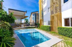 a swimming pool in the backyard of a building at The Havénhouse in Pajak