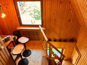 an inside view of a wooden cabin with a window at Apartamenty 1000m npm Murzasichle in Murzasichle