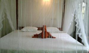 Letto o letti in una camera di Sunstyle Mirissa Guest House