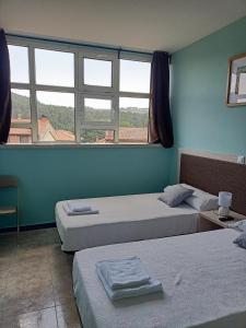 Ένα ή περισσότερα κρεβάτια σε δωμάτιο στο Hostal Camino micológico