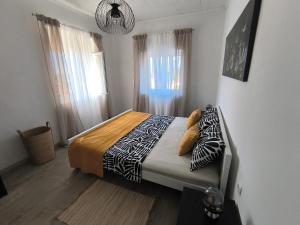 a bedroom with a bed with zebra pillows on it at Bocel in Mali Lošinj
