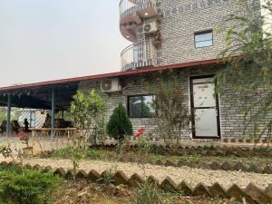 Zahrada ubytování Devchuli Farm House, Luxury Resort