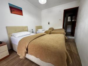 Ένα ή περισσότερα κρεβάτια σε δωμάτιο στο Pergamonpension