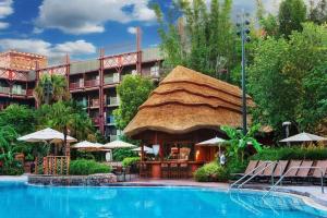 a resort with a large swimming pool with a large building at Disney's Animal Kingdom Lodge in Orlando