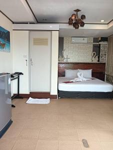 En eller flere senge i et værelse på Lanta Siri Resort