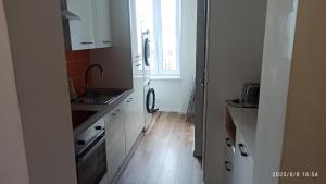 Η κουζίνα ή μικρή κουζίνα στο Luksusowy Apartament przy dworcu +219 φωτογραφίες