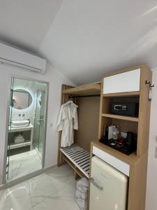 a bathroom with a walk in shower and a sink at Villa Antonis in Parga