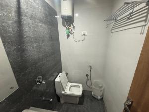 a bathroom with a toilet and a camera in it at Hotel Silver Moon-200 meter Jaipur Junction in Jaipur +31 photos