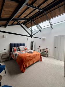 a bedroom with a bed and a desk in it at Historic waterfront factory house Royal William Yd in Plymouth