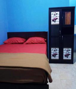 Ένα ή περισσότερα κρεβάτια σε δωμάτιο στο Zella Kost & Homestay