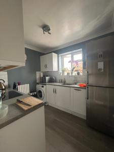 Kuchyň nebo kuchyňský kout v ubytování Homely flat in Surrey + 3 fotografie