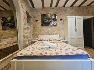 a bedroom with a bed in a room at Patrik Patrik in Kotor