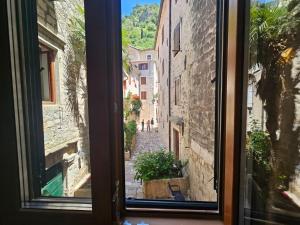 a view of an alley from a window at Patrik Patrik in Kotor +4 photos