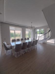 a large room with a long table and chairs at Quba Panoramik Villa in Quba