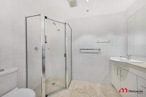 a bathroom with a shower and a toilet and a sink at MetaWise 1Bed Next to ICC Darling Harbour 154 in Sydney +14 photos