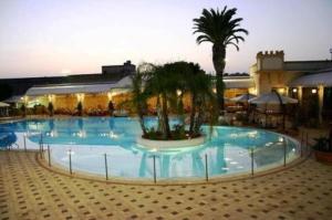 Bazén v ubytování Grand Hotel Palace nebo v jeho okolí