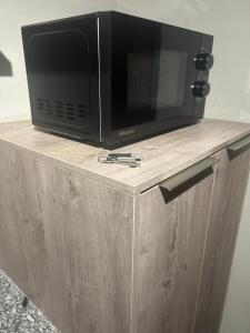 Televisyen dan/atau pusat hiburan di Cosy Apartment