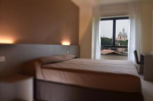 Postel nebo postele na pokoji v ubytování TH Assisi - Casa Leonori