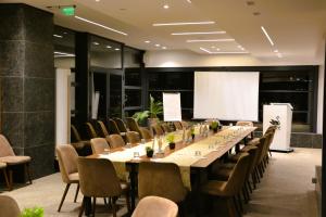 a large conference room with a long table and chairs at Park Lakeside Ohrid in Ohrid