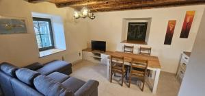 a living room with a couch and a table at Vacation House Viskic in Supetarska Draga