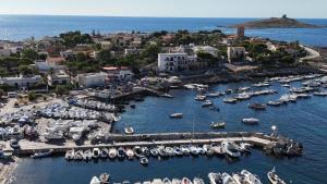 an aerial view of a marina with boats in the water at Caterina in Isola delle Femmine