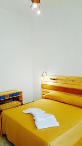 Postel nebo postele na pokoji v ubytování Casa della Nonna Polignano a mare