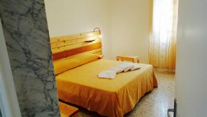 Postel nebo postele na pokoji v ubytování Casa della Nonna Polignano a mare