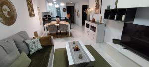 a living room with a couch and a table at cal'Nathalie in San Juan de los Terreros