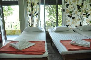 Postel nebo postele na pokoji v ubytování Chestnut Hill Eco Resort Had Yai + 37 fotografií