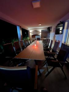 a conference room with a long table and chairs at Villa Star Lux Bijeljina in Bijeljina +21 photos