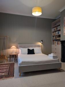 a bedroom with a large white bed in a room at Your CBD Treetop Base | Parking, Wifi & Views in Kings Park