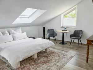 Postel nebo postele na pokoji v ubytování Green Hotel Limburg