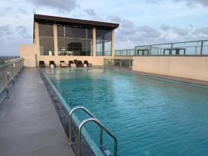 a swimming pool on the roof of a building at High Tides End Ceylon Negombo in Negombo