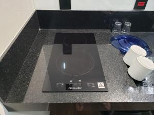 a computer mouse sitting on top of a counter at Tiny House na Pousada Hortelã-Pimenta in Itirapina