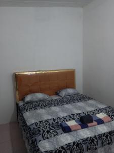 Ένα ή περισσότερα κρεβάτια σε δωμάτιο στο Edu Guesthouse