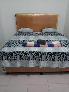 Ένα ή περισσότερα κρεβάτια σε δωμάτιο στο Edu Guesthouse