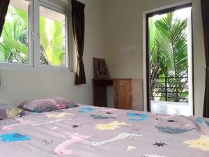 Katil atau katil-katil dalam bilik di SriMahi Farmhouse